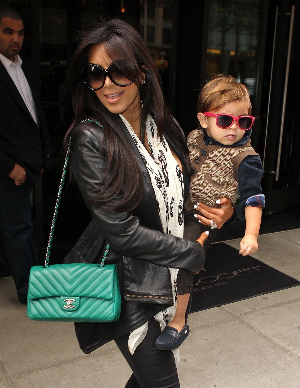 kim_kardashian_holding_her_nephew_mason_disick_green_chanel_bag_alexander_mcqueen_scarf_white_sunglasses