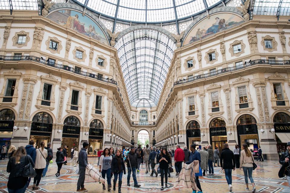 Shoppers at the Galleria Vittorio Emanuele II shopping mall in Milan. Photo Courtesy: Alessia Pierdomenico/Bloomberg