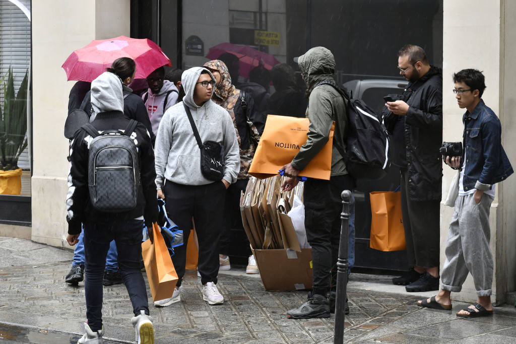 Outside the Louis Vuitton x Supreme launch in Paris. Photo Courtesy: Dominique Maître/WWD