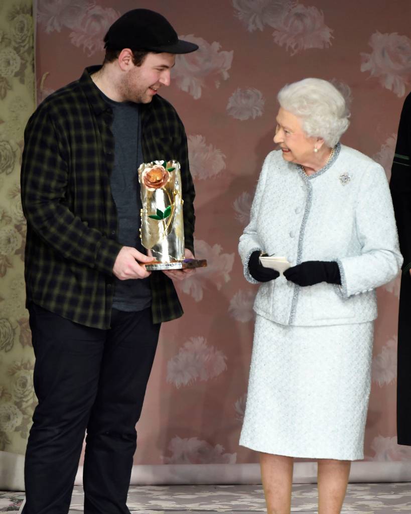 The Queen presents Richard Quinn with the inaugural Queen Elizabeth II award for British design. Photo courtesy: WWD/REX/Shutterstock