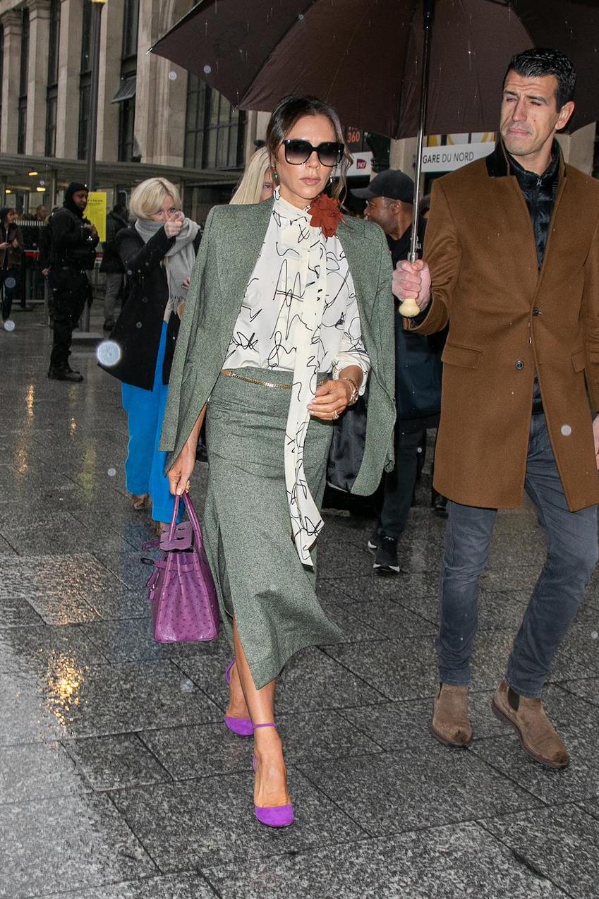 Victoria Beckham with one of her many Hermes Birkin bags, dangling from the  crook of her arm - Fashion Galleries