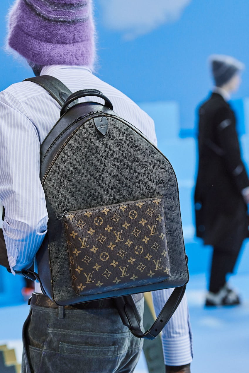 Man with blue leather Louis Vuitton backpack with elephant before Daks  fashion show, Milan Fashion Week street style on January 14, 2018 in Milan.  – Stock Editorial Photo © AndreaA. #272280016