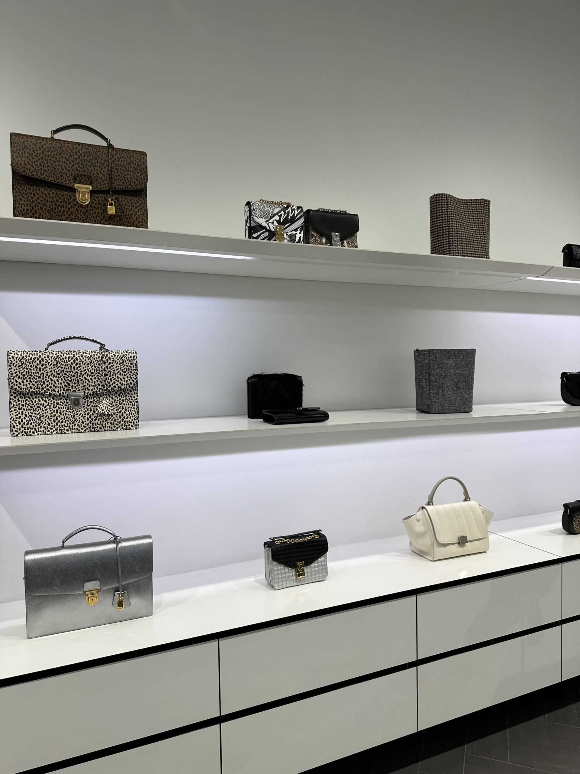 Display bags on the shelf at the Celine outlet in La Vallee Village Paris.