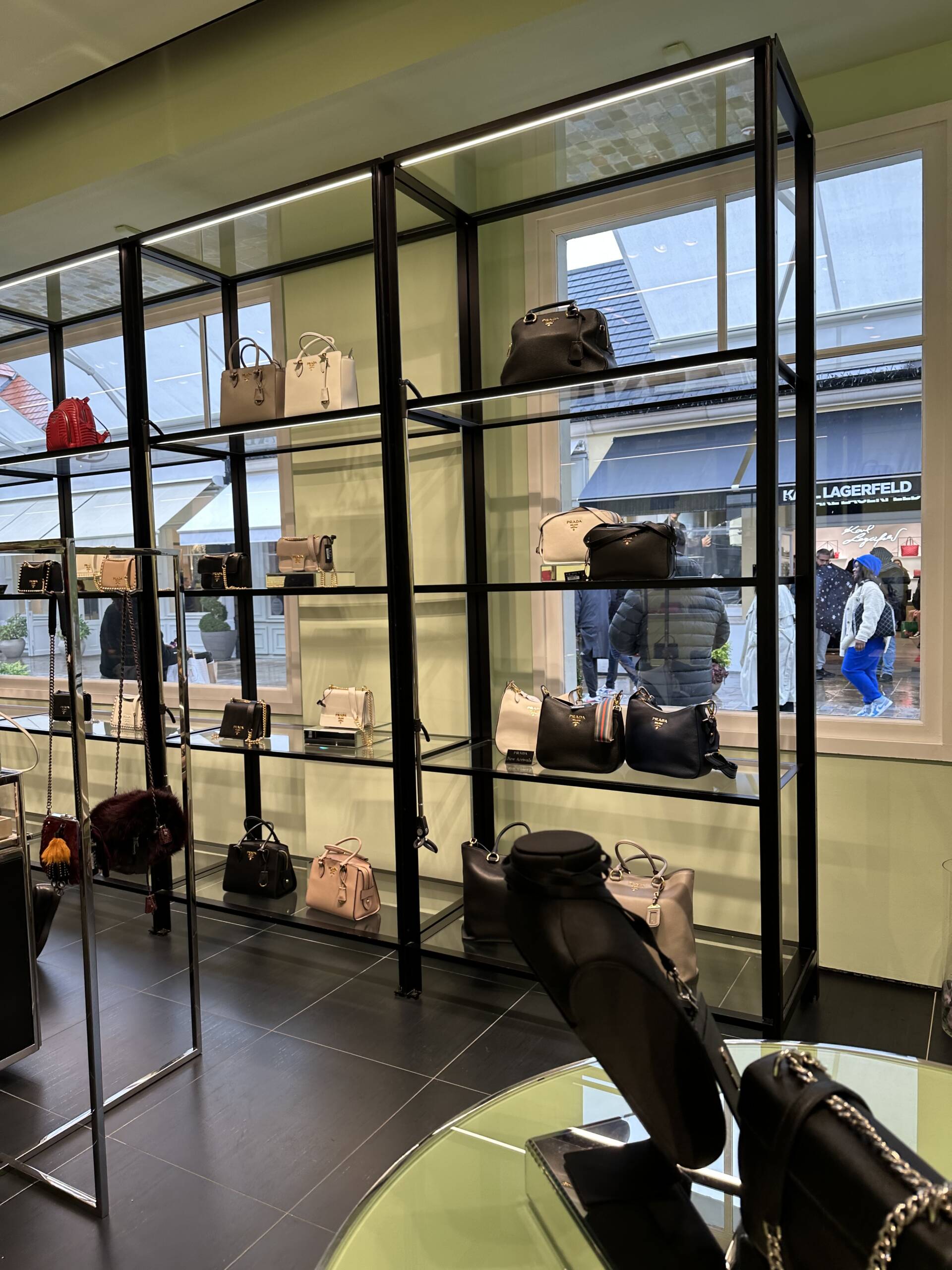 Shopping Prada handbags at the Paris outlet