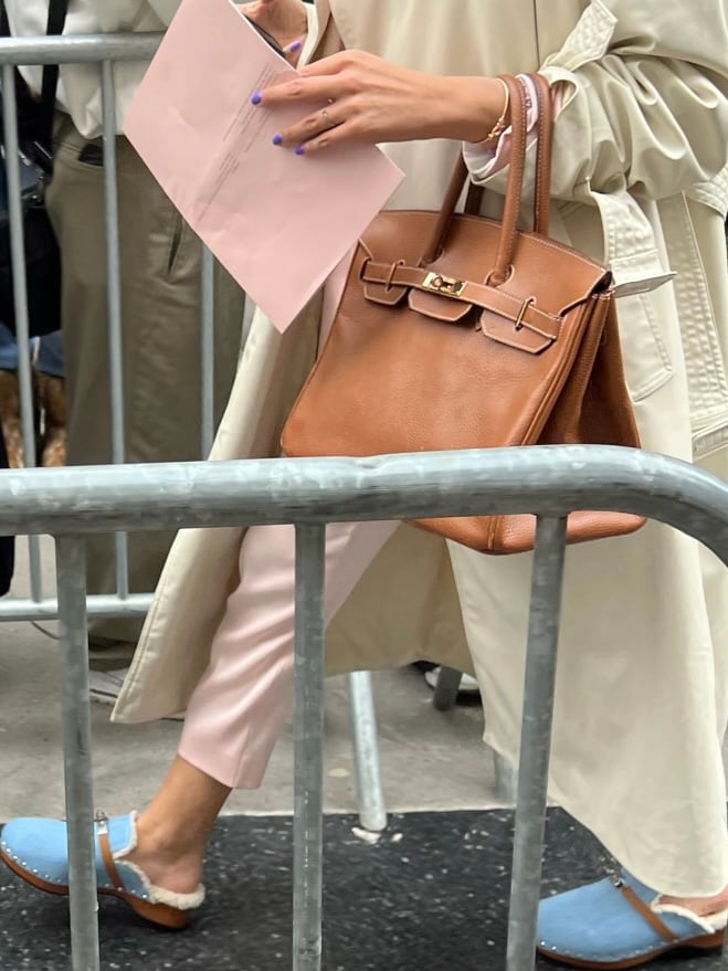 Paris, France - October, 1: woman wearing vintage Kelly 32 bag from Hermes  in burgundy calf box leather, street style outfit details. 素材庫相片