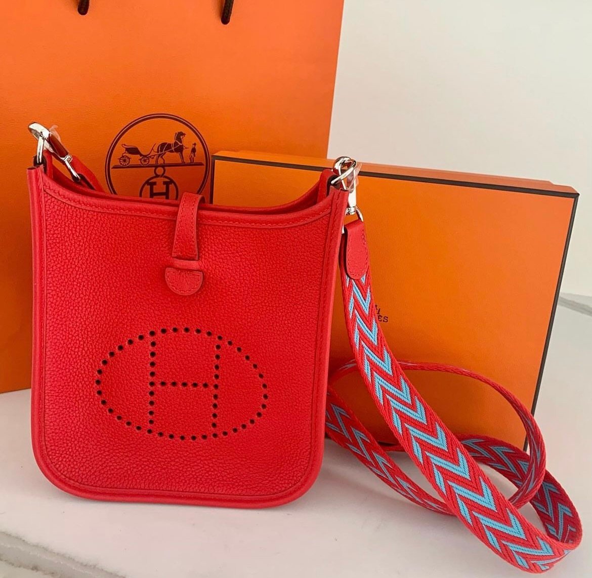 Face-Off: Chanel Jungle Stroll versus Hermes Evelyne - PurseBop