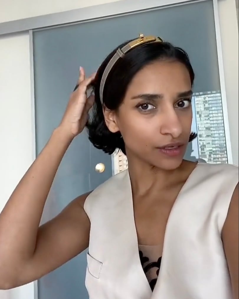 hermes etoupr kelly belt with gold hardware used as a headband